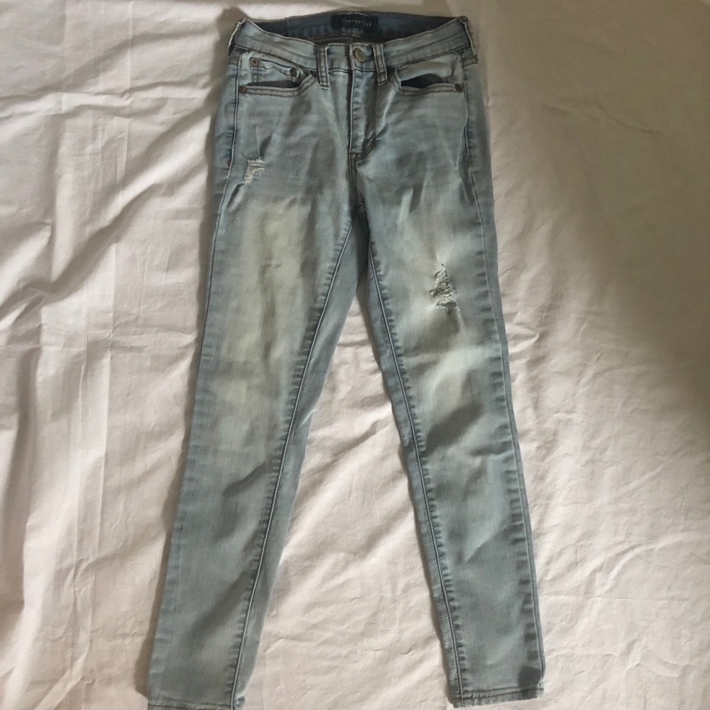Distressed light wash jeans